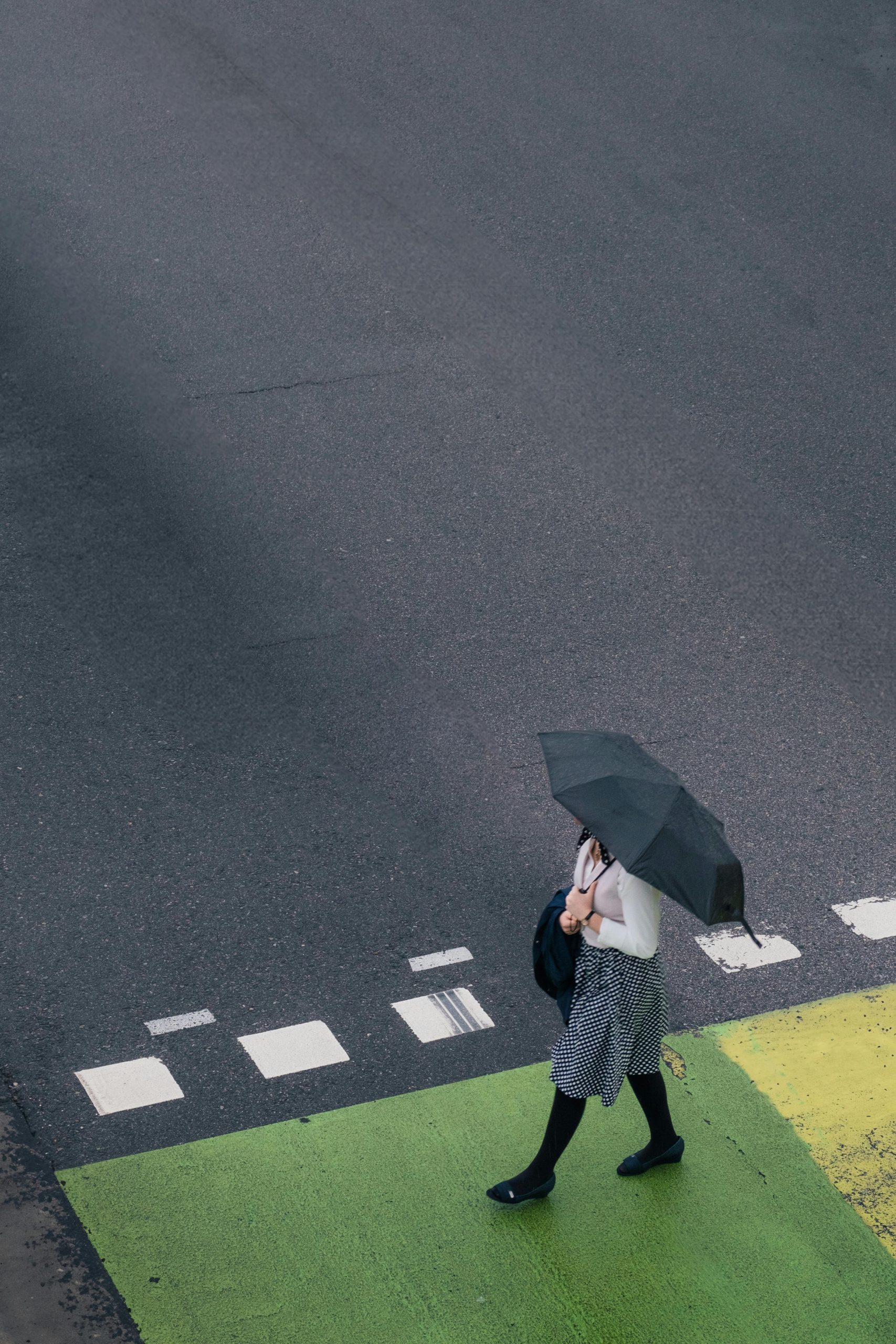 person-umbrella-crosswalk